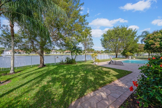 view of yard featuring a fenced in pool and a patio