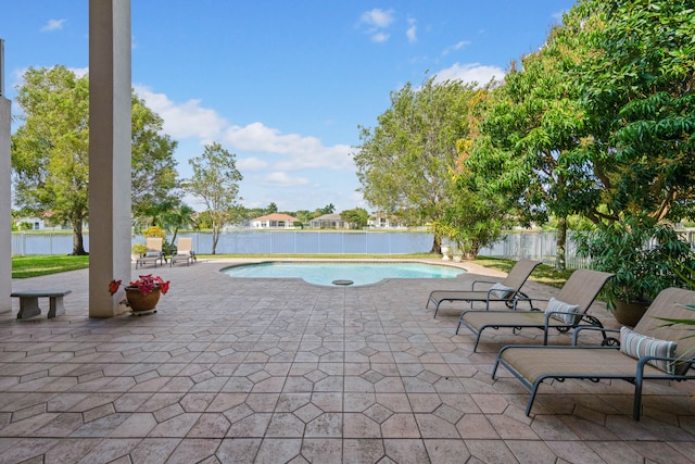 view of terrace with a fenced in pool