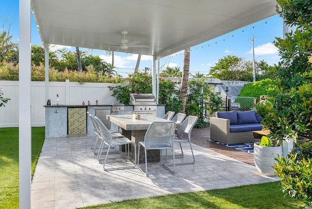 view of patio / terrace featuring exterior kitchen, ceiling fan, an outdoor hangout area, and a grill