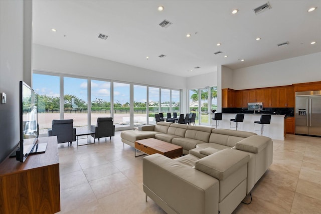 tiled living room with a wealth of natural light