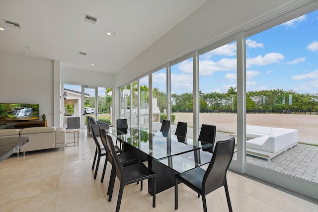 sunroom / solarium featuring a healthy amount of sunlight