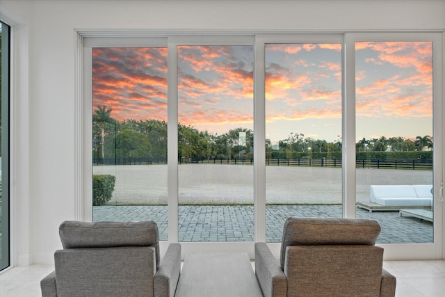 living area featuring light tile floors