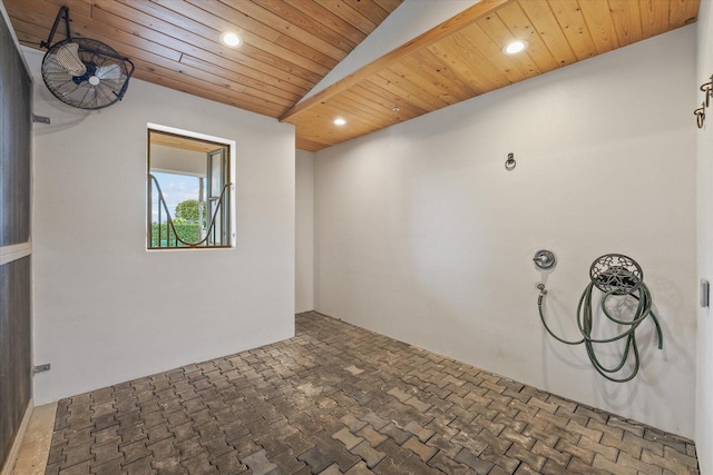 unfurnished room featuring vaulted ceiling and wooden ceiling