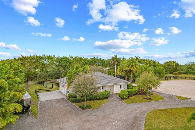 birds eye view of property with a rural view