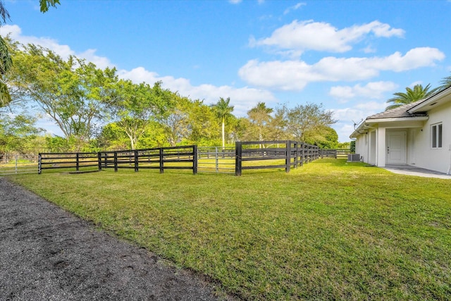 view of yard with a rural view