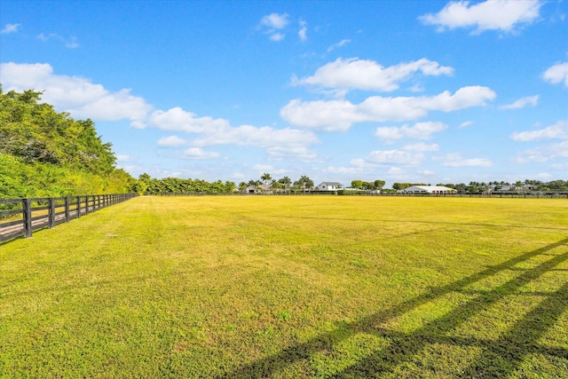 view of yard with a rural view