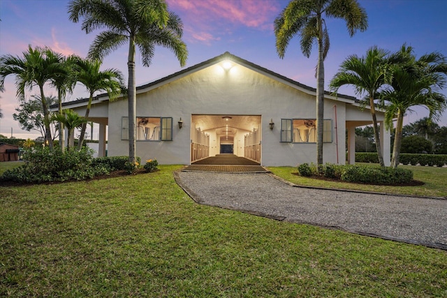 view of front of property with a yard