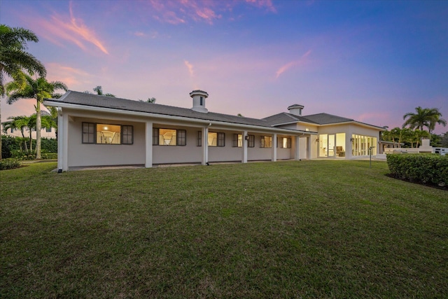 view of front of home with a yard