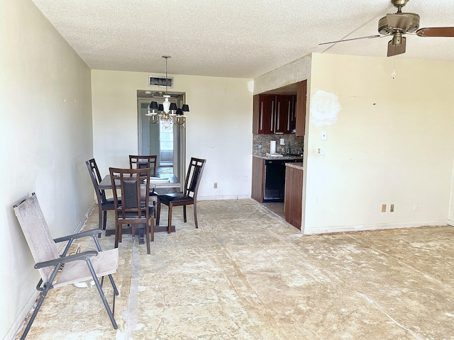 dining space with ceiling fan and a textured ceiling