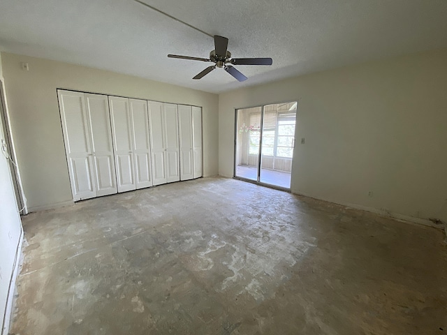 unfurnished bedroom featuring a textured ceiling, access to outside, and ceiling fan