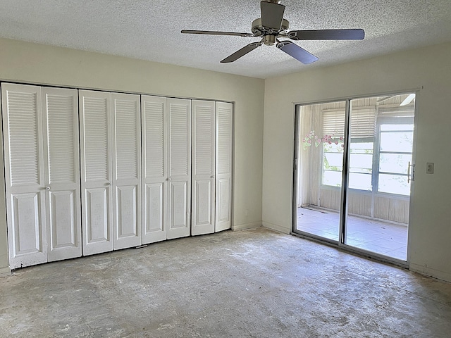 unfurnished bedroom featuring ceiling fan, a textured ceiling, and access to exterior