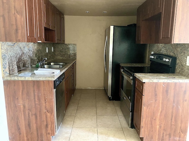 kitchen with sink, appliances with stainless steel finishes, backsplash, and light tile patterned floors