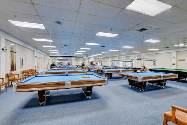 recreation room with pool table, a drop ceiling, and carpet floors