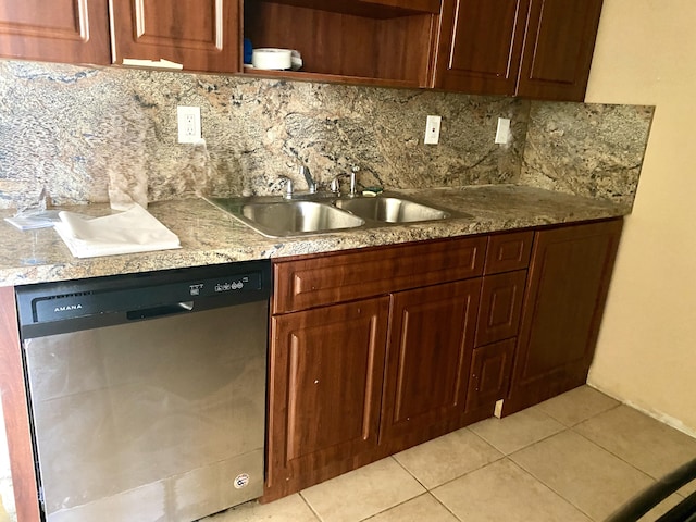 kitchen featuring decorative backsplash, light tile patterned flooring, dishwasher, and sink