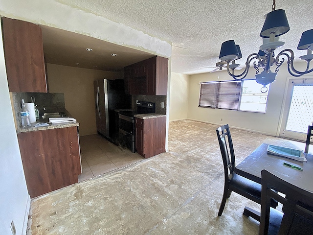 kitchen featuring black electric range, tasteful backsplash, a textured ceiling, stainless steel fridge, and ceiling fan