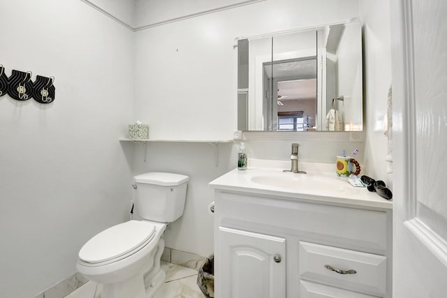 bathroom with tile flooring, oversized vanity, and toilet