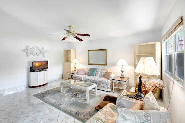 tiled living room featuring ceiling fan