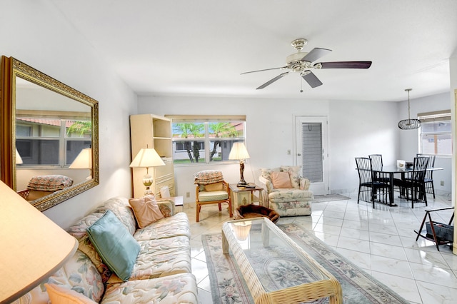 living room featuring ceiling fan and light tile floors