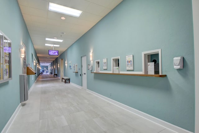 hall with light tile flooring