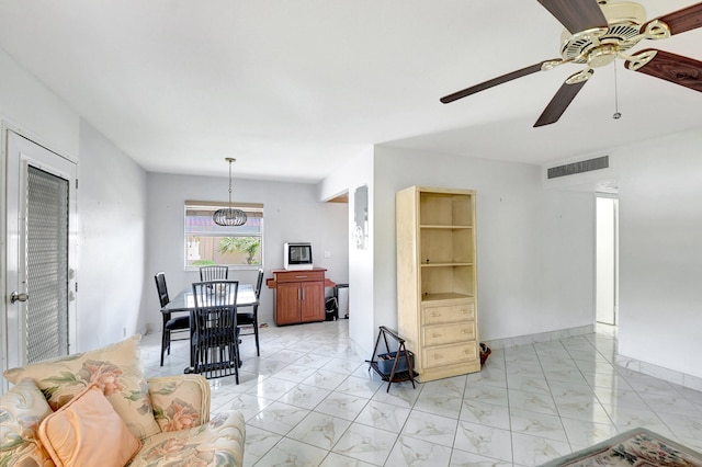 tiled living room featuring ceiling fan