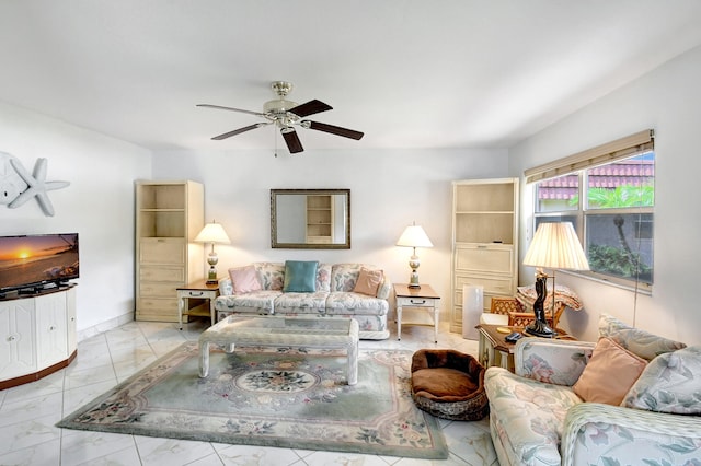 tiled living room with ceiling fan