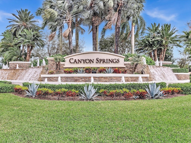 community / neighborhood sign with a lawn