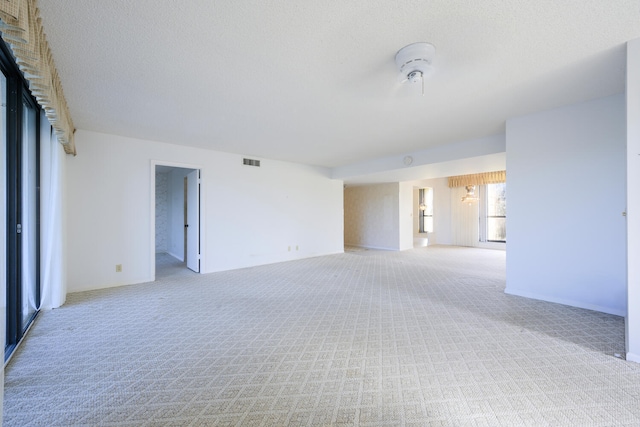 spare room with light carpet