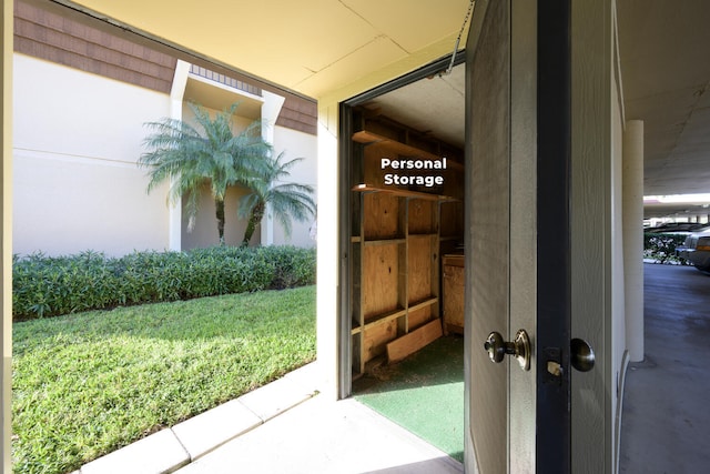 doorway to property featuring a yard