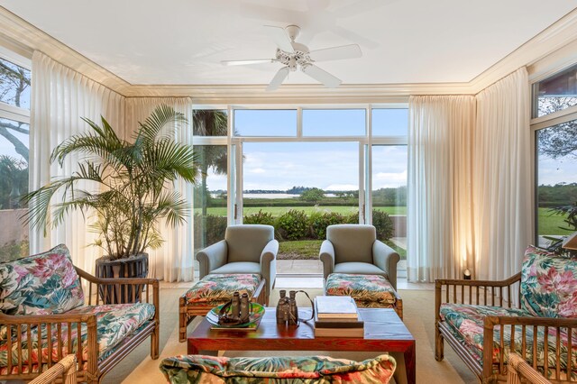 sunroom / solarium featuring ceiling fan