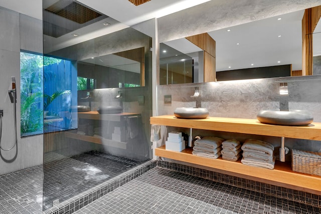 bathroom with vanity, tile flooring, tasteful backsplash, and tile walls