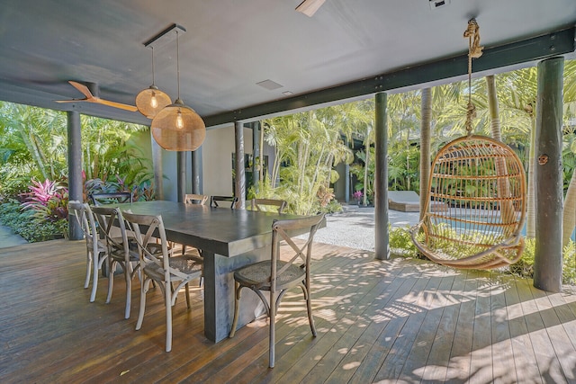 sunroom featuring ceiling fan and a wealth of natural light