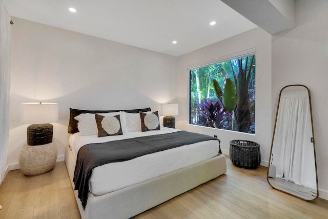 bedroom with light hardwood / wood-style floors