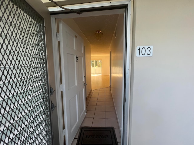 corridor with light tile flooring