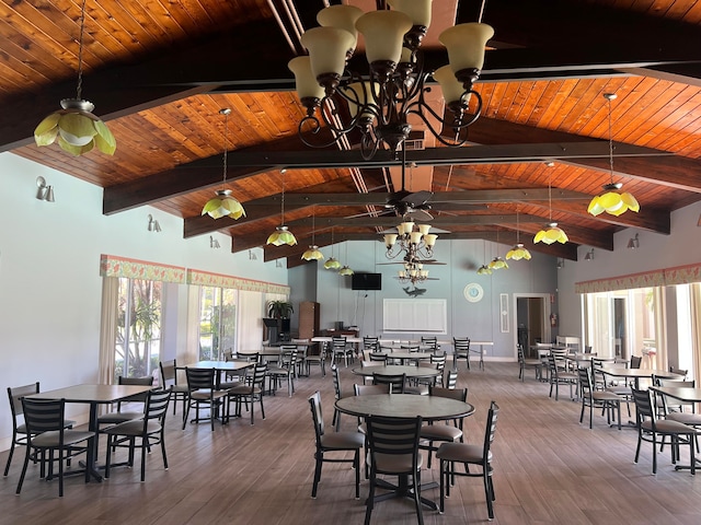 dining area with ceiling fan with notable chandelier and wooden ceiling