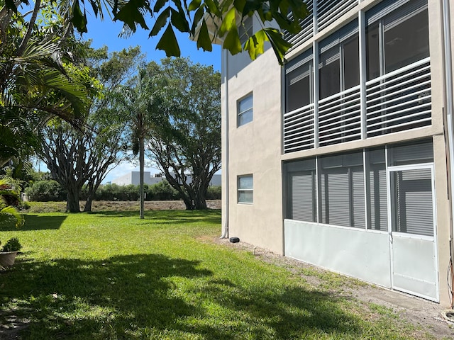 view of property exterior featuring a lawn