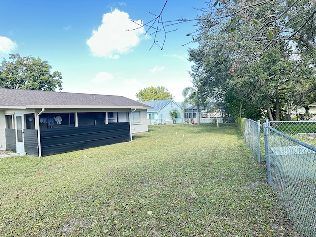 view of yard featuring a sunroom