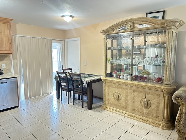 kitchen with dishwasher and light tile patterned floors