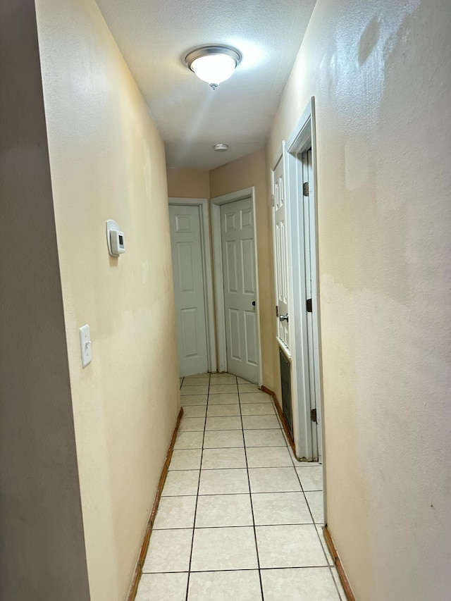 hallway with light tile patterned flooring