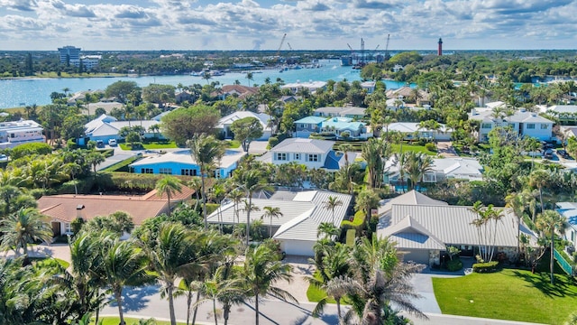 birds eye view of property featuring a water view