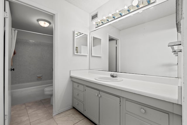 full bathroom with toilet, tile floors, shower / tub combo with curtain, a textured ceiling, and large vanity