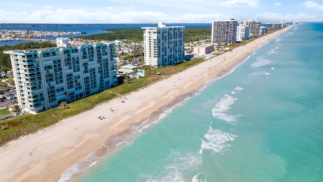 bird's eye view featuring a beach view and a water view