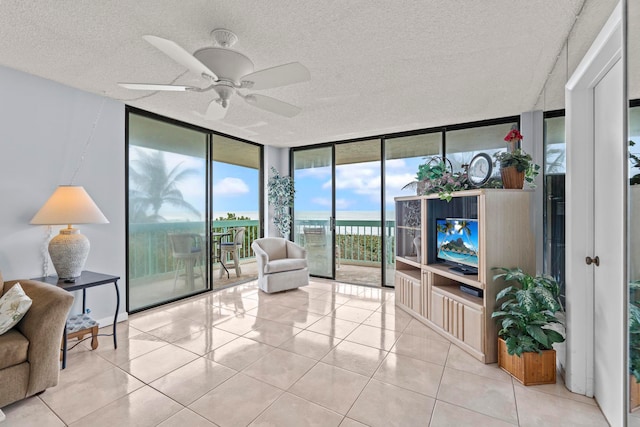 sunroom / solarium with ceiling fan