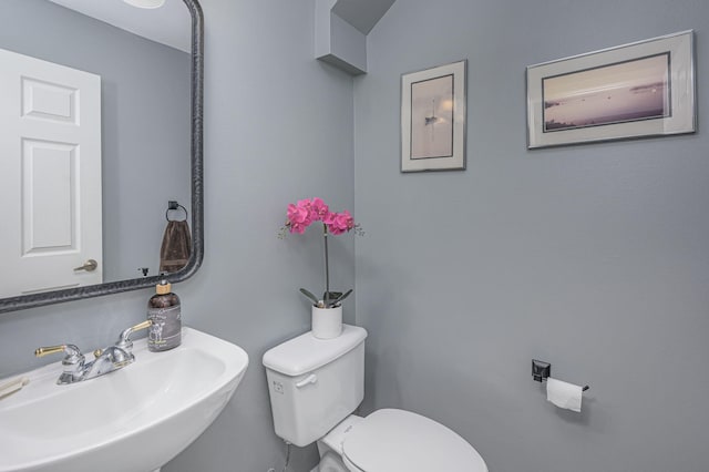 bathroom with sink and toilet