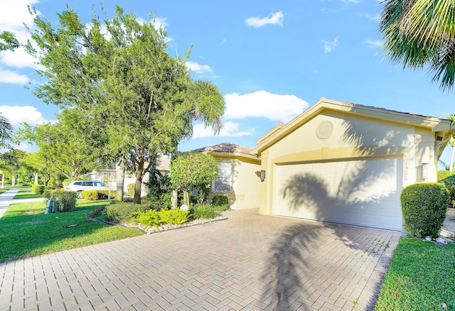 view of front facade with a front lawn and a garage