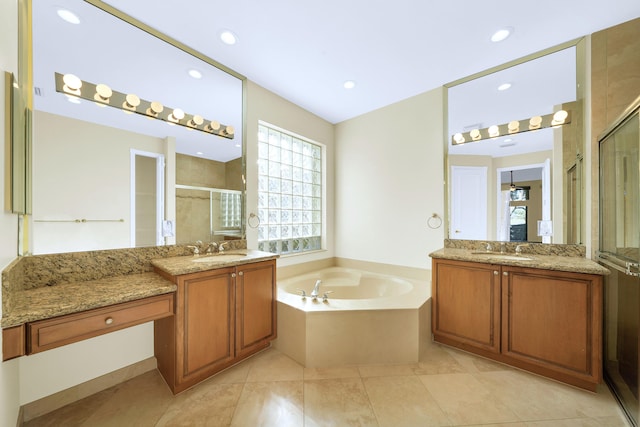 bathroom featuring shower with separate bathtub, tile floors, double sink, and vanity with extensive cabinet space