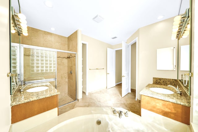 bathroom with tile floors, dual vanity, and plus walk in shower