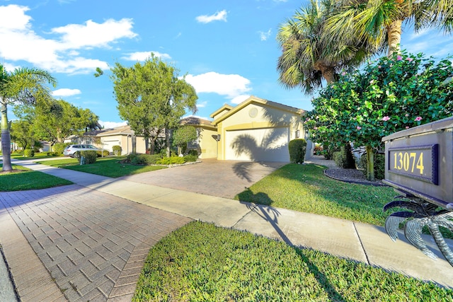 view of front of property with a front lawn and a garage