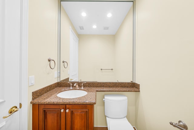 bathroom featuring toilet and oversized vanity