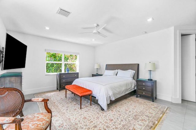 bedroom with light tile floors and ceiling fan