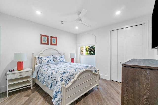 bedroom featuring a closet, ceiling fan, and hardwood / wood-style flooring